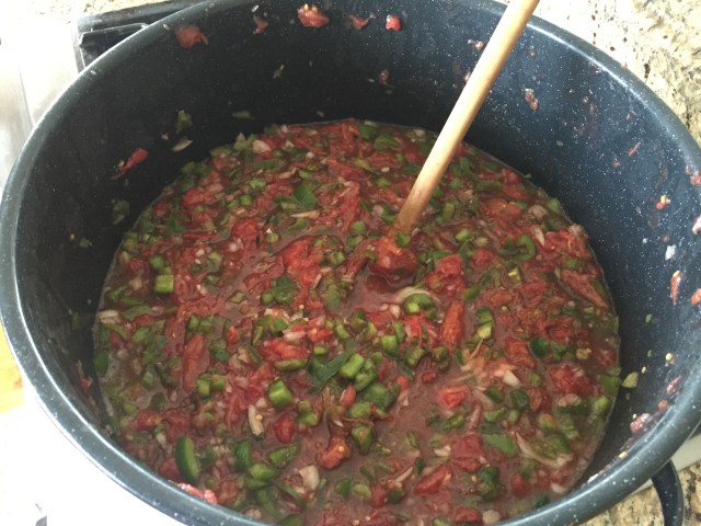 Mixing salsa while heating
